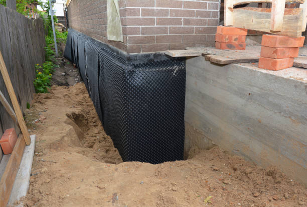 Happy homeowners after waterproofing job in Perry Hall